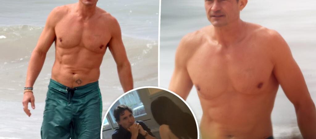 Shirtless Orlando Bloom shows off jacked body at the beach